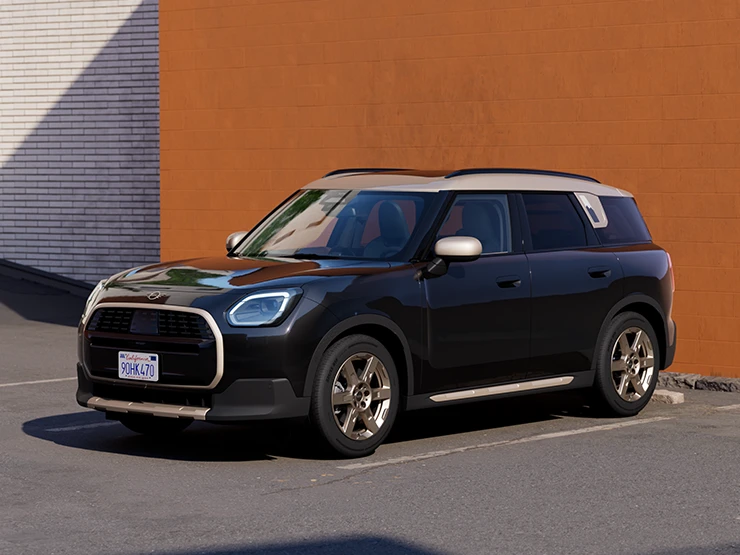 Vue avant latérale du MINI Countryman Midnight Black avec toit Vibrant Silver stationné.